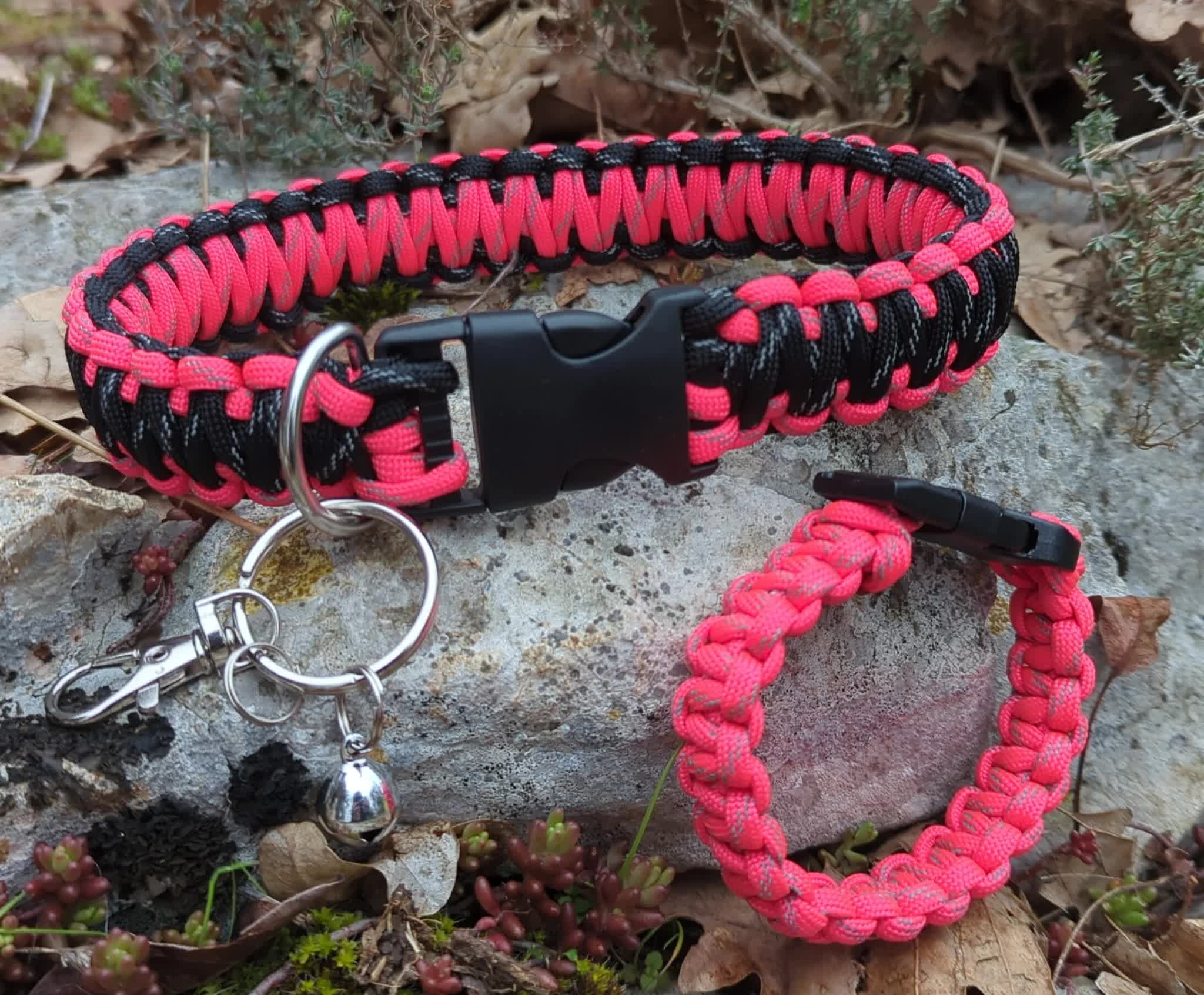 a pink and black collar and bracelet