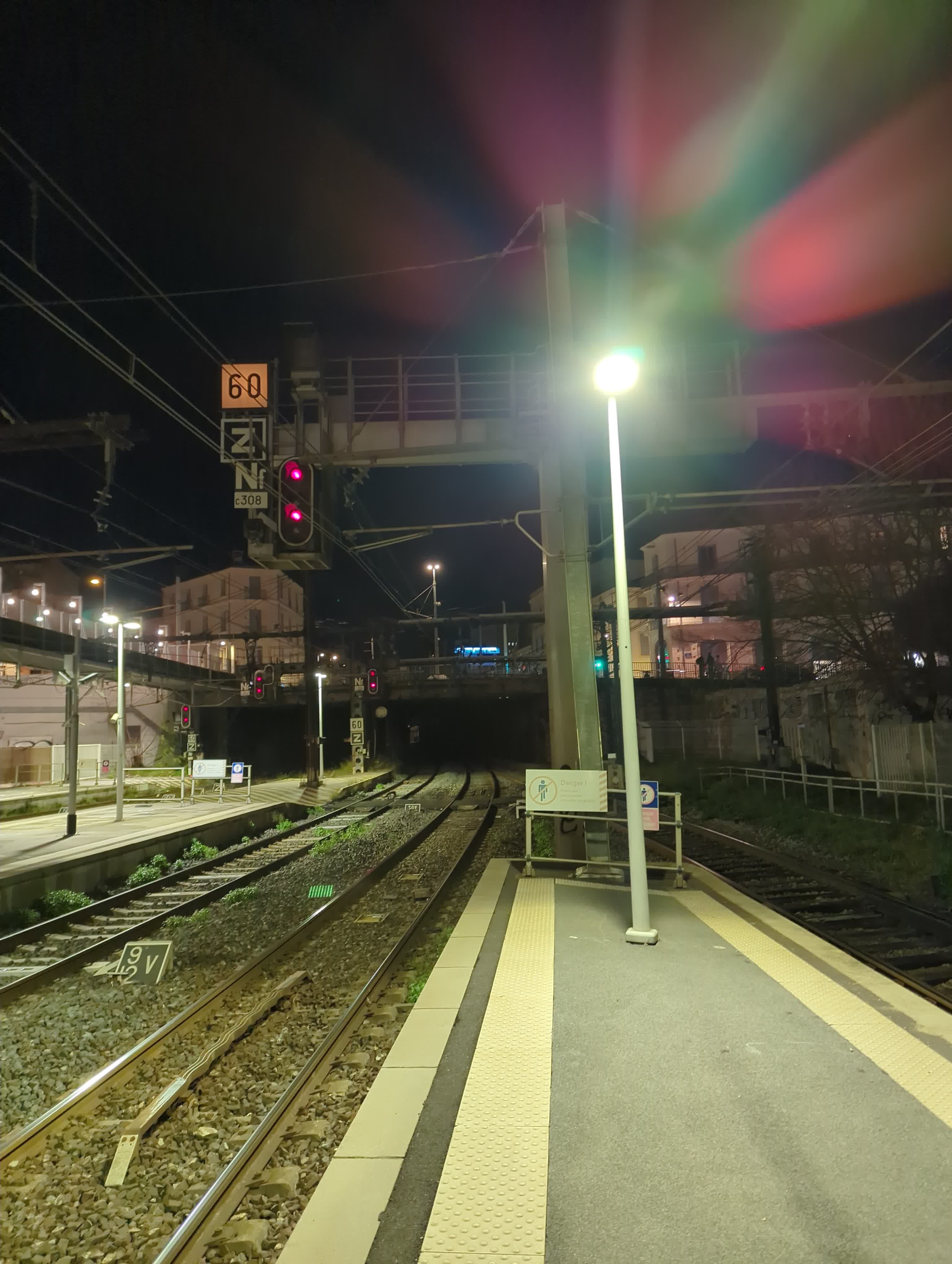 Train tracks and railway signalling shown from the platform