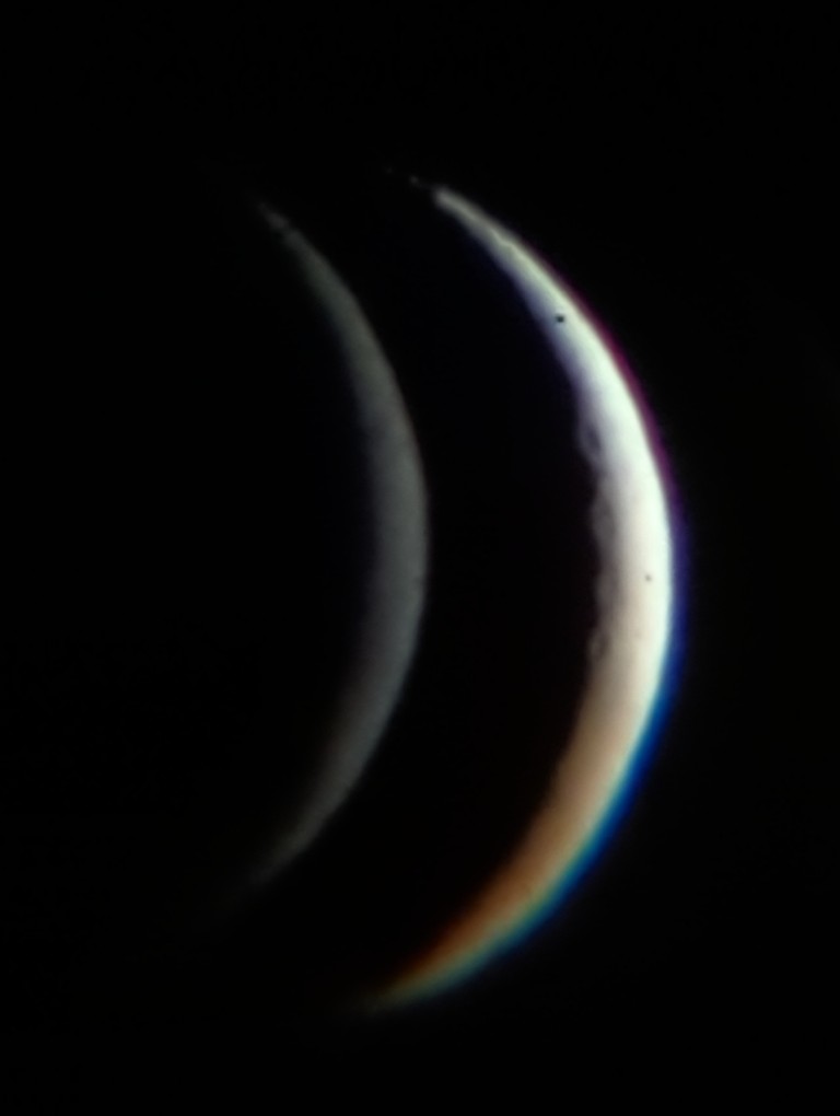 a similar image, much clearer but with a speck of dust on the mirror where the moon is